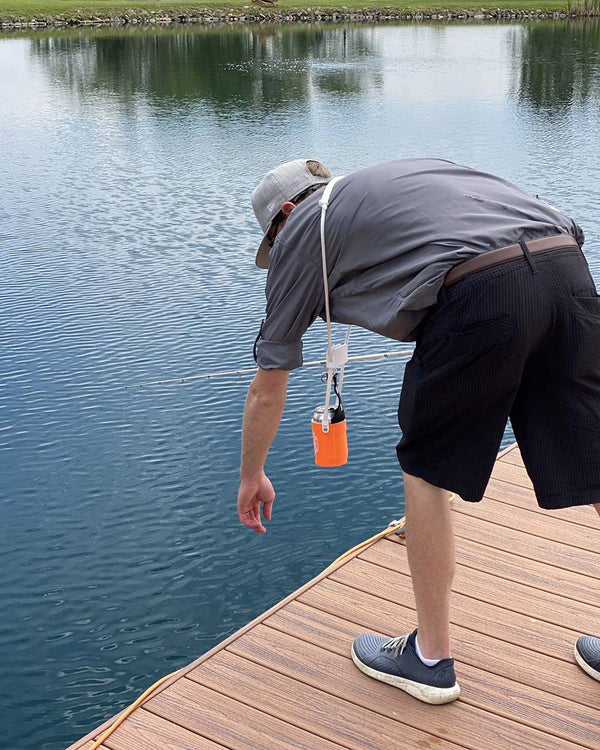 Fishing and bending over side view - orange Sip-Line