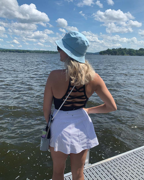 Woman with Grey Sip-Line on Lake dock
