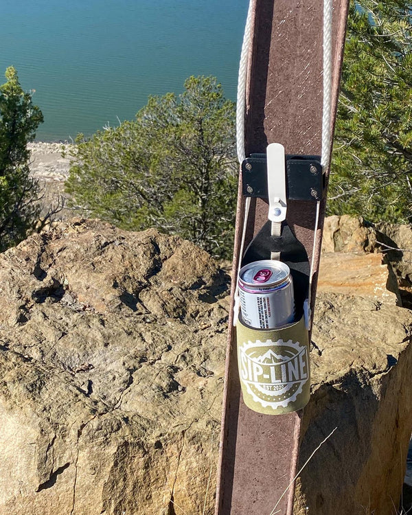 Khaki Sip-Line Can Cooler Hanging from Rafter Outdoors